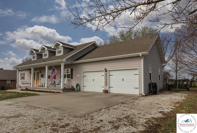new england style home with concrete driveway, a porch, a shingled roof, and an attached garage