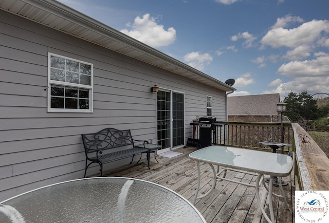 wooden terrace featuring outdoor dining area