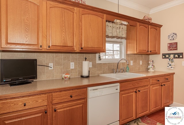 kitchen featuring a sink, white dishwasher, tasteful backsplash, crown molding, and light countertops