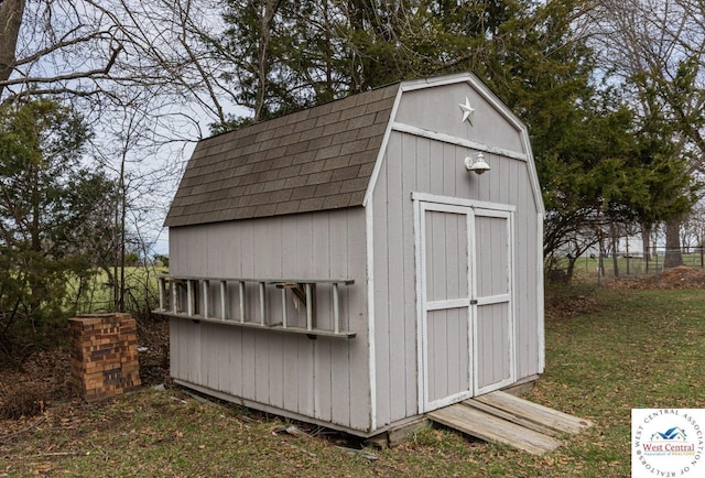 view of shed with fence