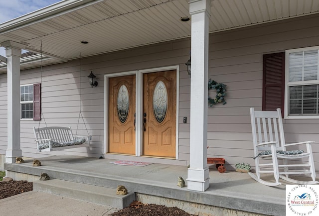 entrance to property with covered porch