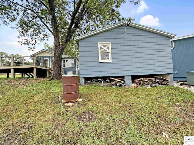 26684 Waterview Dr, Warsaw, MO 65355 - view of home's exterior with a lawn and a wooden deck