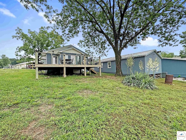 26684 Waterview Dr, Warsaw, MO 65355 - back of house with a deck, a lawn, and stairway