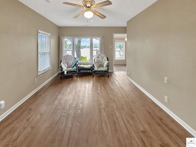 26684 Waterview Dr, Warsaw, MO 65355 - sitting room featuring a ceiling fan and wood finished floors
