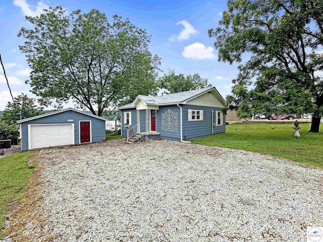 26684 Waterview Dr, Warsaw, MO 65355 - ranch-style house with an outbuilding, a detached garage, gravel driveway, and a front lawn