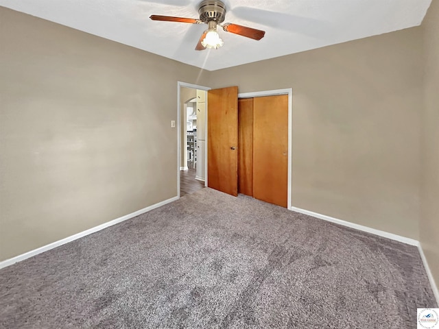 26684 Waterview Dr, Warsaw, MO 65355 - unfurnished bedroom with carpet, a closet, and a ceiling fan