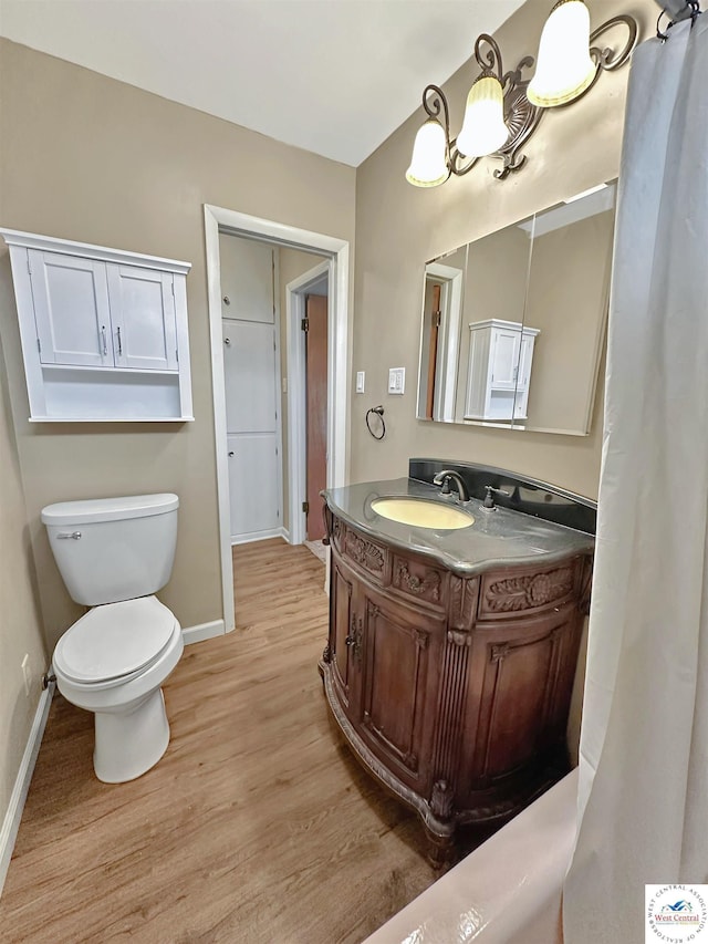 26684 Waterview Dr, Warsaw, MO 65355 - full bath featuring wood finished floors, vanity, and a chandelier
