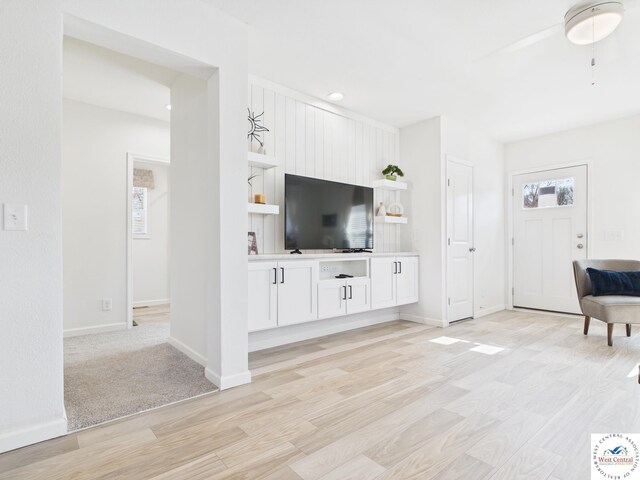 100 Mayerling Dr, Laurie, MO 65037 - living area with baseboards, a ceiling fan, and light wood-style flooring