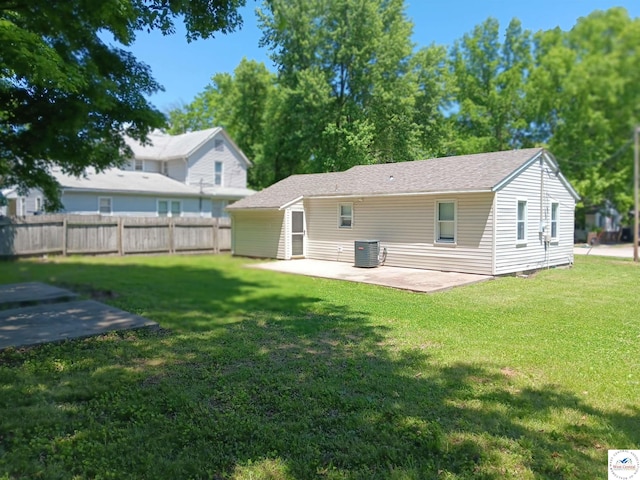 219 S 6th St, Clinton, MO 64735 - back of property featuring a patio area and central AC