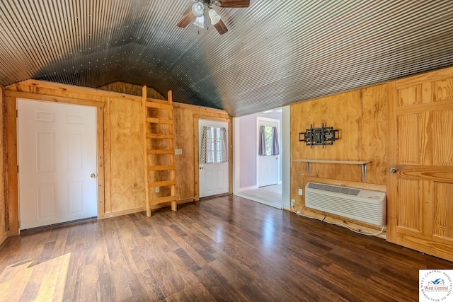 28848 Paradise Dr, Warsaw, MO 65355 - interior space with wooden walls, ceiling fan, a wall unit AC, wood finished floors, and lofted ceiling