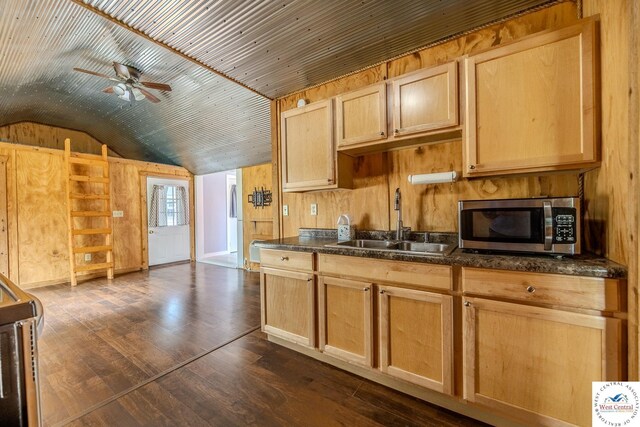 28848 Paradise Dr, Warsaw, MO 65355 - kitchen with ceiling fan, dark countertops, a sink, stainless steel microwave, and lofted ceiling