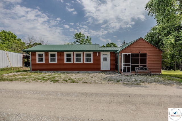 28848 Paradise Dr, Warsaw, MO 65355 - view of front of property with metal roof and log veneer siding