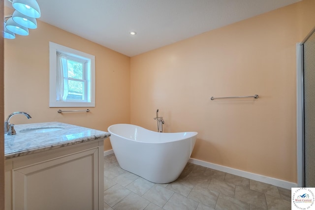 28848 Paradise Dr, Warsaw, MO 65355 - full bathroom with a freestanding tub, tile patterned flooring, vanity, baseboards, and recessed lighting