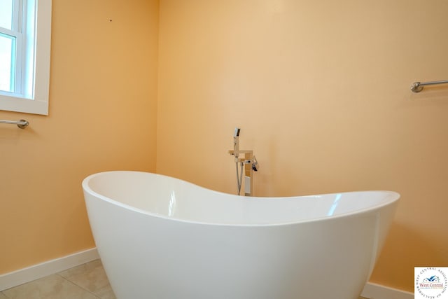 28848 Paradise Dr, Warsaw, MO 65355 - full bath featuring tile patterned flooring, baseboards, and a soaking tub