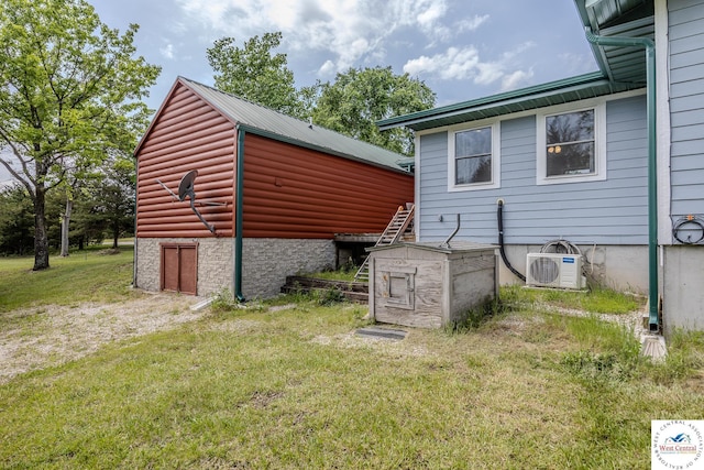 28848 Paradise Dr, Warsaw, MO 65355 - view of property exterior featuring a yard, ac unit, and metal roof