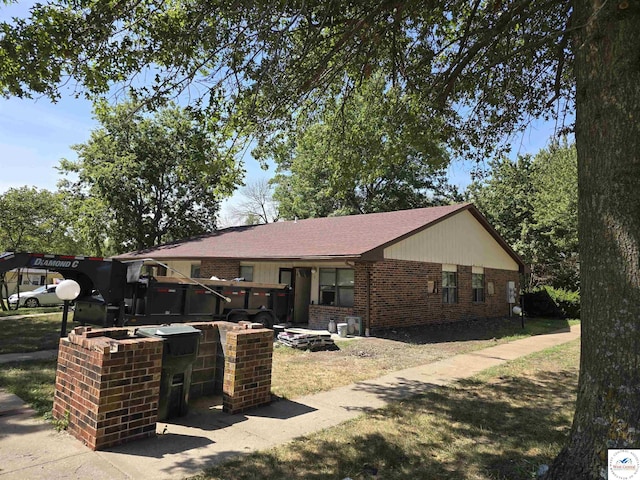 206 N Ohio St, Chilhowee, MO 64733 - view of front of property with brick siding and a shingled roof