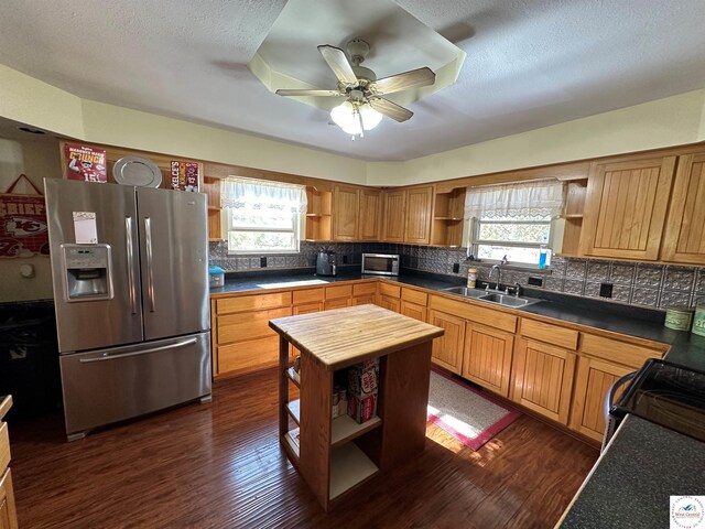 23111 Lange Rd, Cole Camp, MO 65325 - kitchen with open shelves, appliances with stainless steel finishes, dark wood-style flooring, a sink, and a ceiling fan