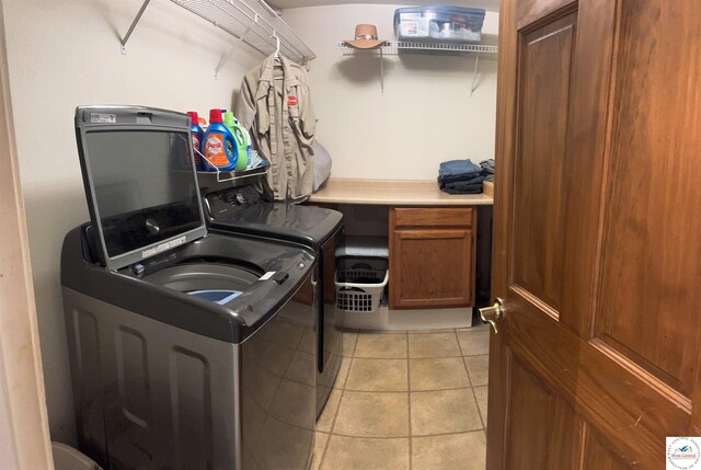 23111 Lange Rd, Cole Camp, MO 65325 - washroom featuring light tile patterned floors, washer and dryer, and laundry area