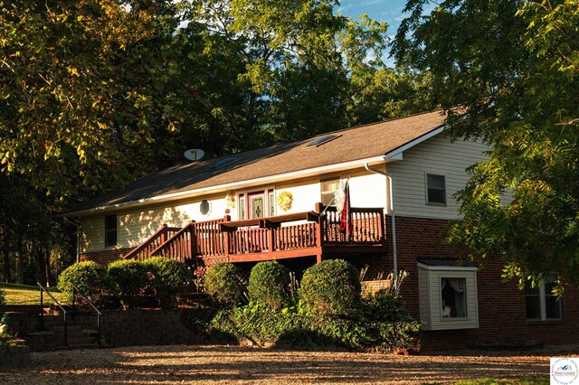 23111 Lange Rd, Cole Camp, MO 65325 - back of property with a deck and brick siding