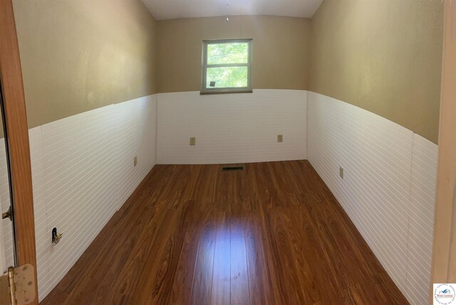23111 Lange Rd, Cole Camp, MO 65325 - spare room featuring wood finished floors, visible vents, and wainscoting