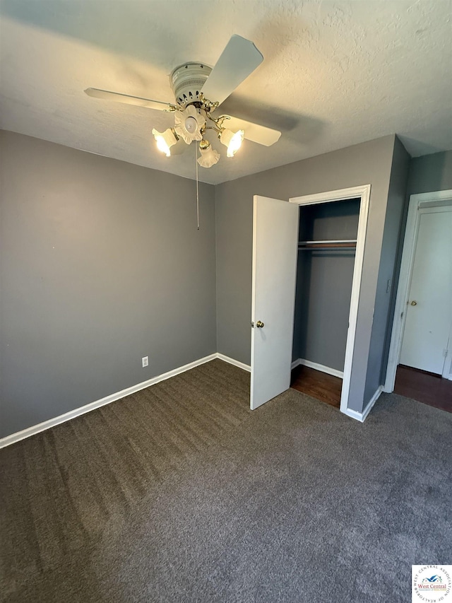 7801 Ozark Rd, Kansas City, MO 64129 - unfurnished bedroom featuring carpet floors, a ceiling fan, and a closet