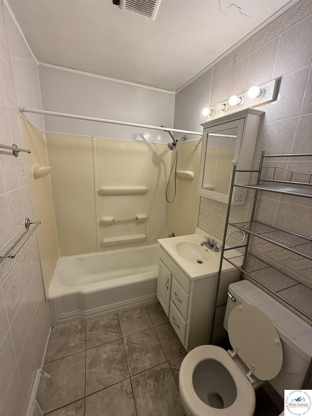 7801 Ozark Rd, Kansas City, MO 64129 - full bath featuring tile walls, tub / shower combination, and vanity