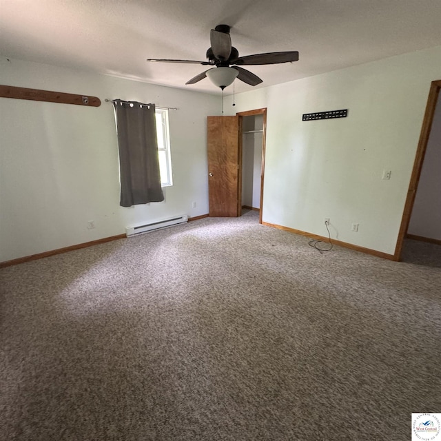 unfurnished bedroom featuring a ceiling fan, a closet, a baseboard heating unit, baseboards, and carpet flooring