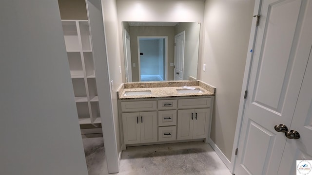 302 E Jamestown Dr, Clinton, MO 64735 - bathroom with double vanity and unfinished concrete flooring