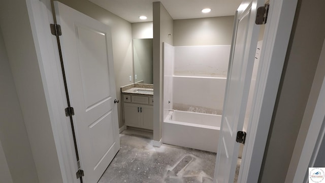 302 E Jamestown Dr, Clinton, MO 64735 - full bath with vanity, a bath, and concrete floors
