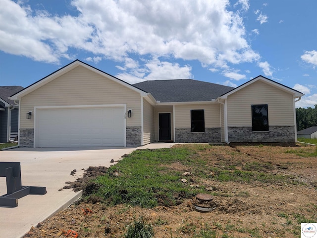 302 E Jamestown Dr, Clinton, MO 64735 - ranch-style home featuring a garage, concrete driveway, and a shingled roof