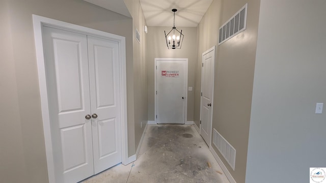 302 E Jamestown Dr, Clinton, MO 64735 - doorway with a chandelier and concrete flooring
