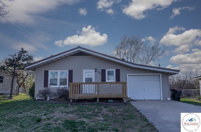 ranch-style home featuring a garage, fence, and concrete driveway