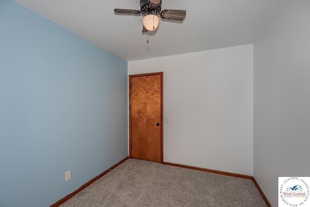 empty room featuring a ceiling fan, carpet flooring, and baseboards