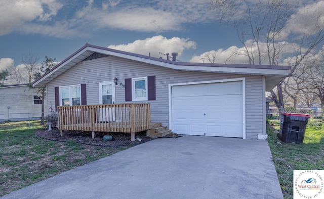 ranch-style home with fence, concrete driveway, and a garage