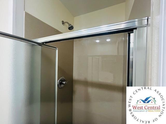 45869 E Hwy, Milan, MO 63556 - bathroom featuring a shower with door