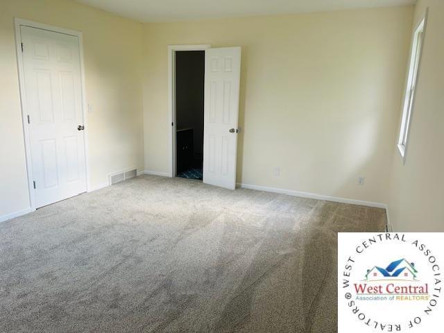 45869 E Hwy, Milan, MO 63556 - unfurnished bedroom with carpet flooring and multiple windows