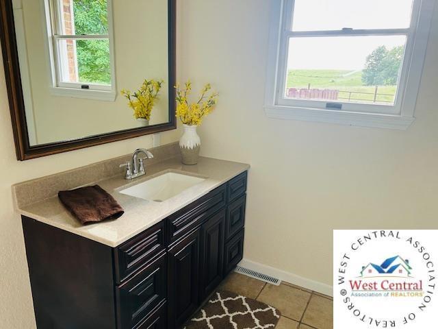 45869 E Hwy, Milan, MO 63556 - bathroom featuring vanity and tile patterned flooring