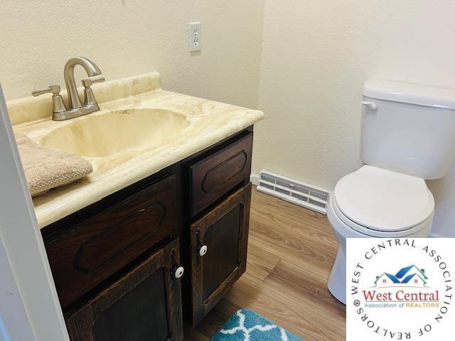 45869 E Hwy, Milan, MO 63556 - bathroom featuring vanity and wood finished floors