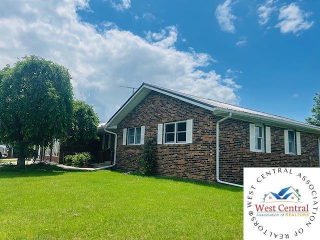 45869 E Hwy, Milan, MO 63556 - view of side of property with a lawn and brick siding
