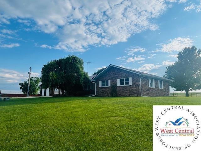 45869 E Hwy, Milan, MO 63556 - view of front facade with stone siding and a front lawn