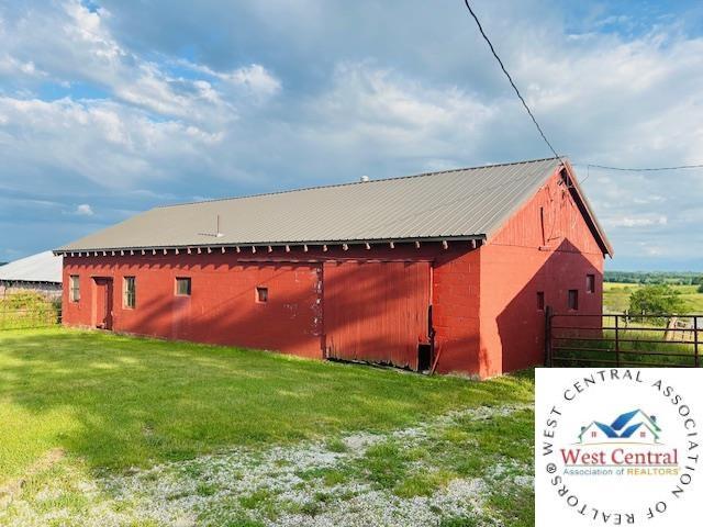 45869 E Hwy, Milan, MO 63556 - view of side of property featuring a metal roof and an outbuilding