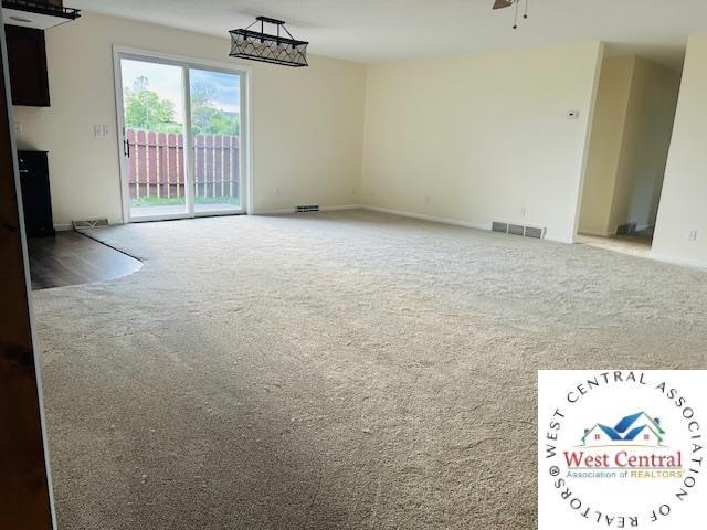 45869 E Hwy, Milan, MO 63556 - carpeted spare room featuring baseboards and ceiling fan