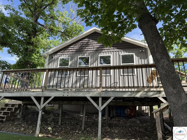 back of property with a wooden deck
