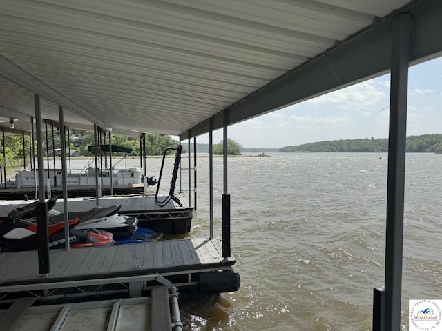 dock featuring a water view and boat lift