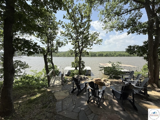 view of patio featuring a water view