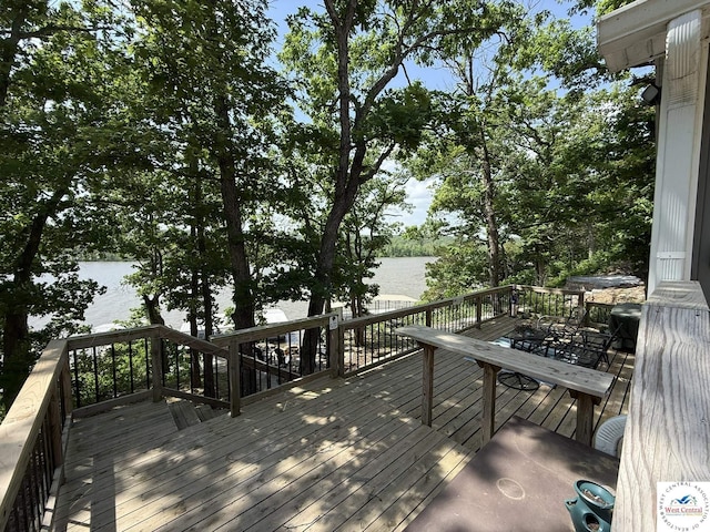 wooden terrace with a water view