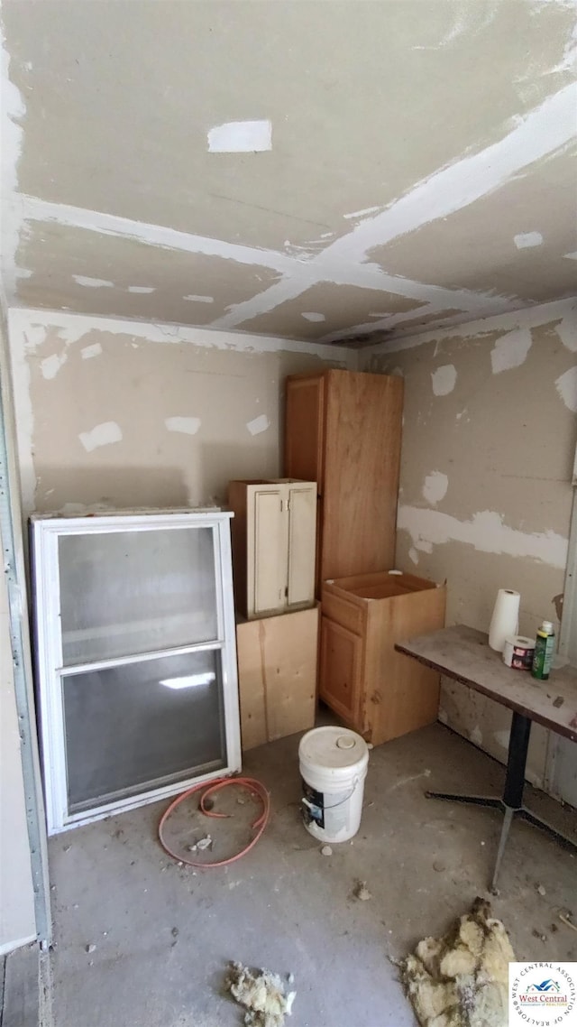207 S Olive St, Calhoun, MO 65323 - interior space featuring unfinished concrete flooring