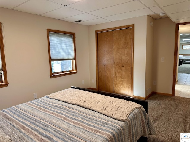 32291 Barclay Loop, Warsaw, MO 65355 - bedroom featuring a drop ceiling, baseboards, light colored carpet, and a closet