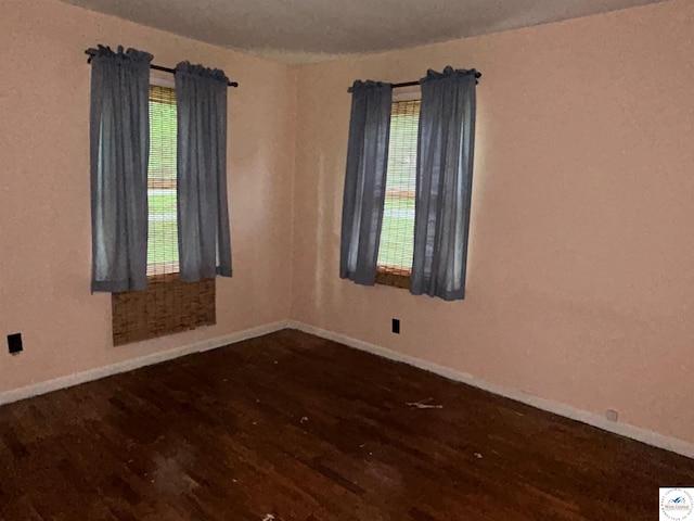 1511 Polk St, Warsaw, MO 65355 - spare room featuring wood finished floors and baseboards