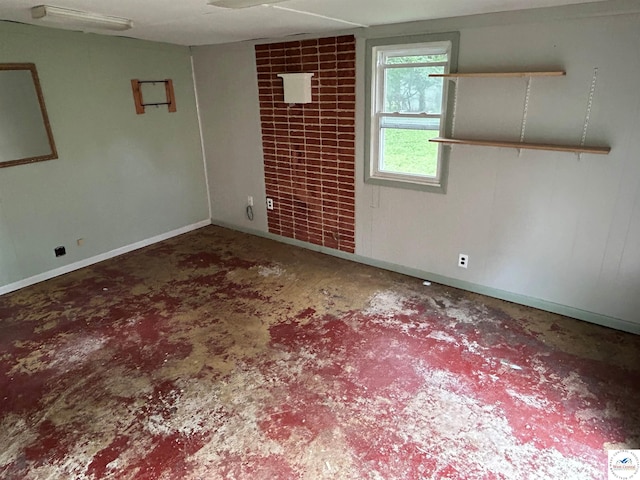 1511 Polk St, Warsaw, MO 65355 - spare room with concrete flooring